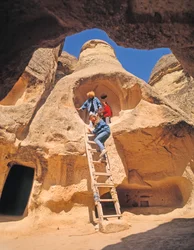 Tourists Exploring Cave Houses